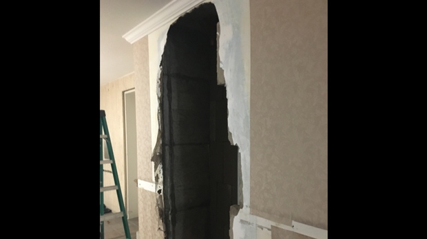 A recent picture obtained by CP24 shows a hallway inside Bruce McArthur's Thorncliffe Park Drive home. Det. Sgt. Hank Idsinga said forensics officers removed a section of wall from the hallway to inspect pipes beneath the wall. 
